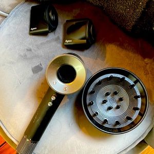 2020 Dyson Hair dryer with the shown attachments. Black/silver/chrome color